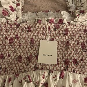 Floral puffed Sleeve cottage core midi dress with Pink Accents.